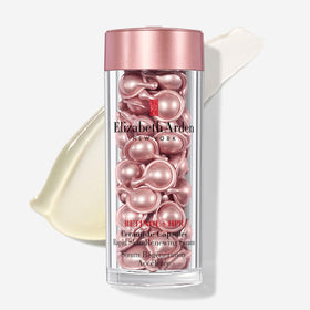 Elizabeth Arden capsules pouring shot showing precise dosing for day and night use.