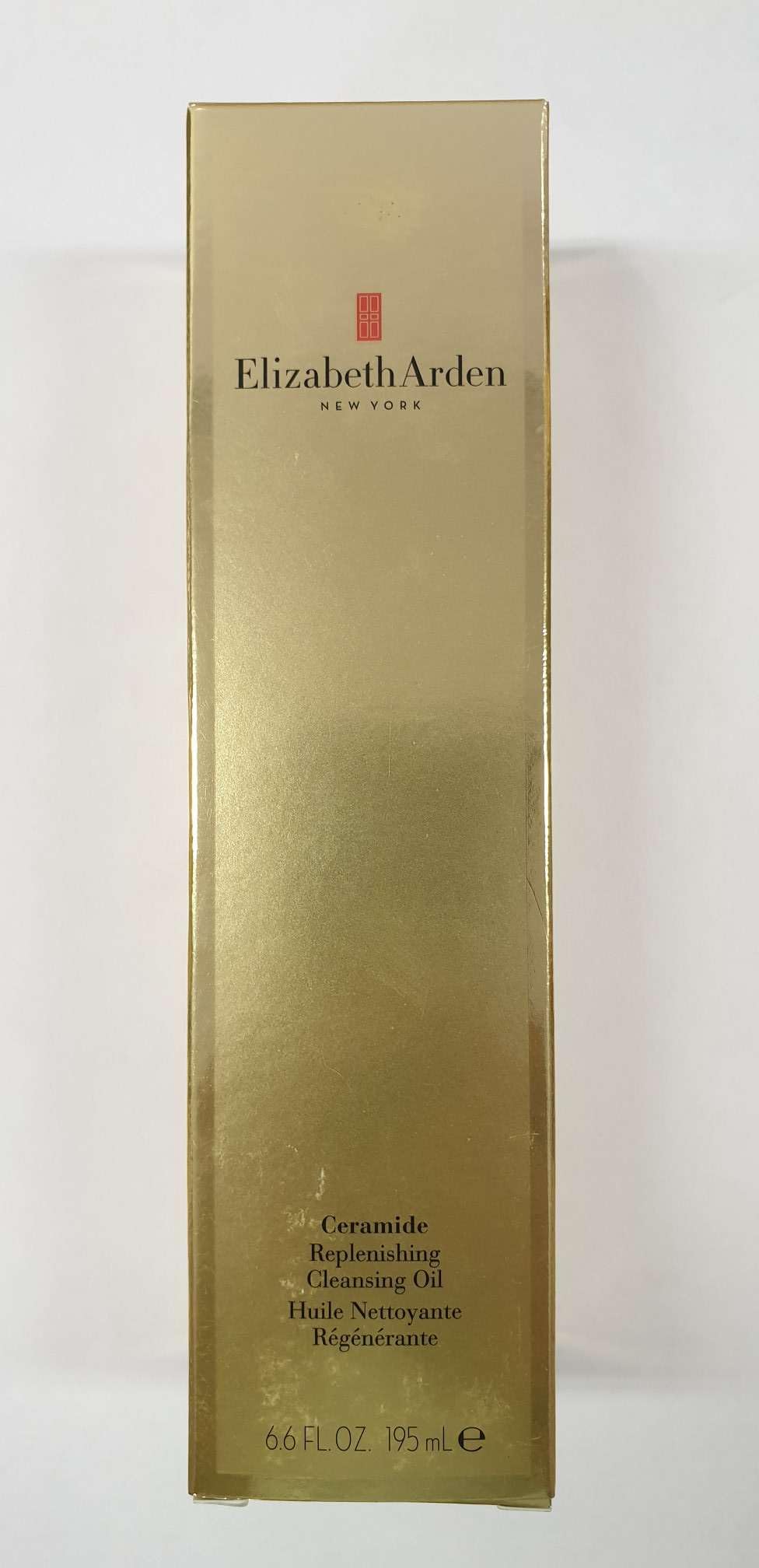Elizabeth Arden Ceramide Replenishing Cleansing Oil bottle pour showing smooth application and makeup removal