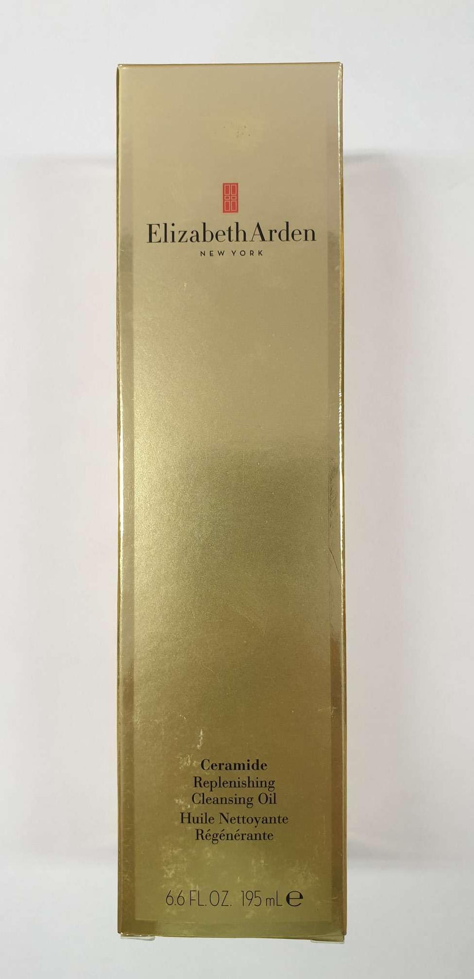Elizabeth Arden Ceramide Replenishing Cleansing Oil bottle pour showing smooth application and makeup removal