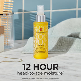 Elizabeth Arden Eight Hour All-Over Miracle Oil bottle on hair application for frizz control and shine.
