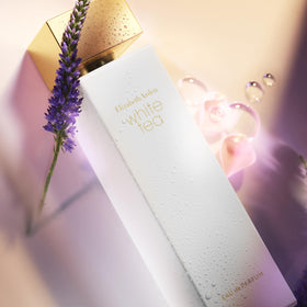 Elizabeth Arden White Tea EDP bottle on wood surface suggests everyday luxury