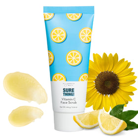 Elizabeth Mott Sure Thing Vitamin C Face Scrub jar close-up, gentle exfoliation on skin.