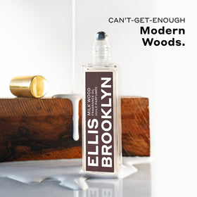 Ellis Brooklyn Milk Wood travel-size bottle emphasized for easy packing.