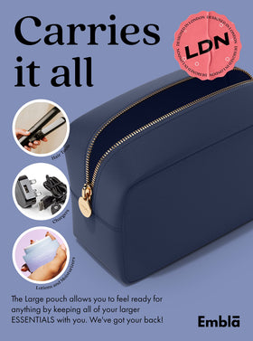 Embla clutch-style makeup bag in navy doubles as a chic everyday carry