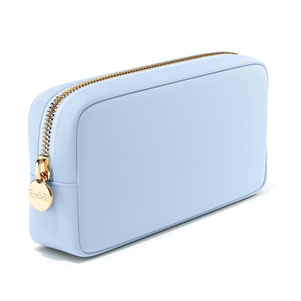 Embla sky blue makeup bag front view shows durable nylon for travel organization.