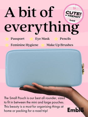 Embla sky blue makeup bag interior highlights secure zipper and easy access.