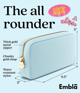 Embla sky blue makeup bag open view reveals organized compartments for cosmetics.