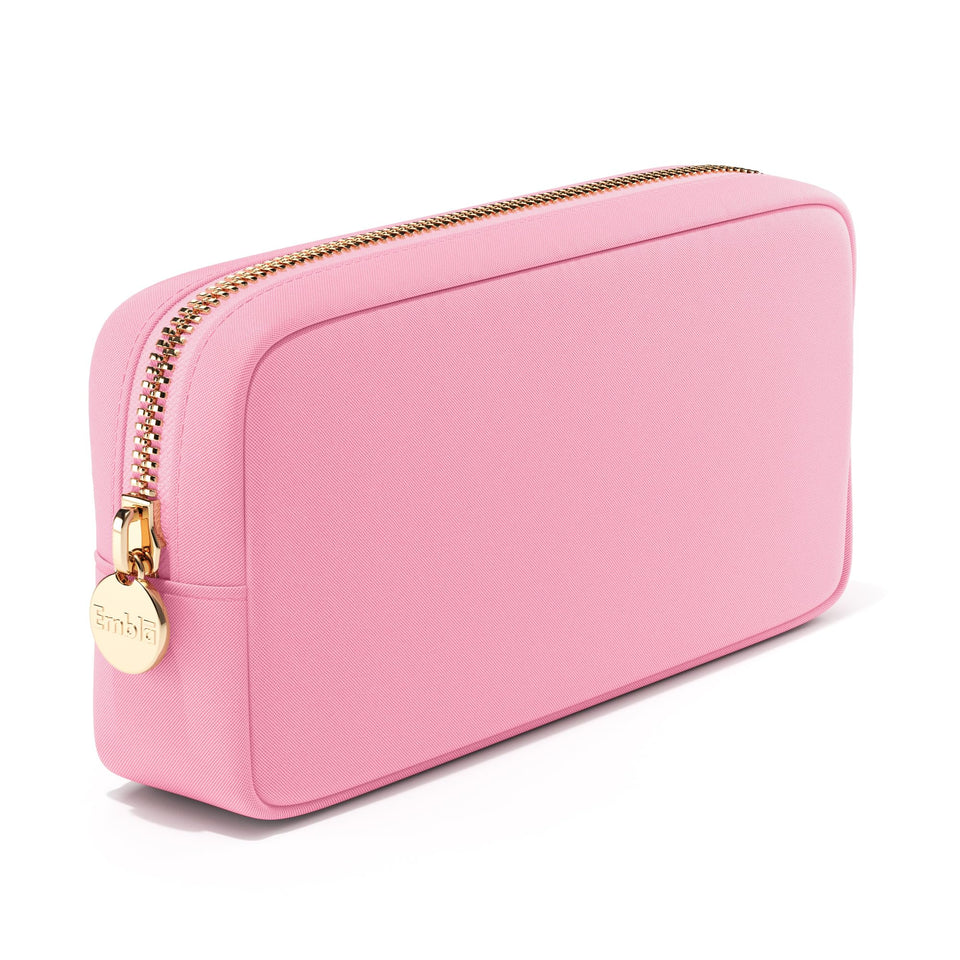 Embla makeup bag Flamingo Pink keeps cosmetics organized during travel.