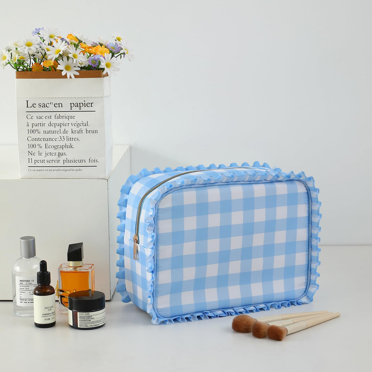 EMBRUNIOICE blue bag side profile emphasizes slim, travel-ready silhouette