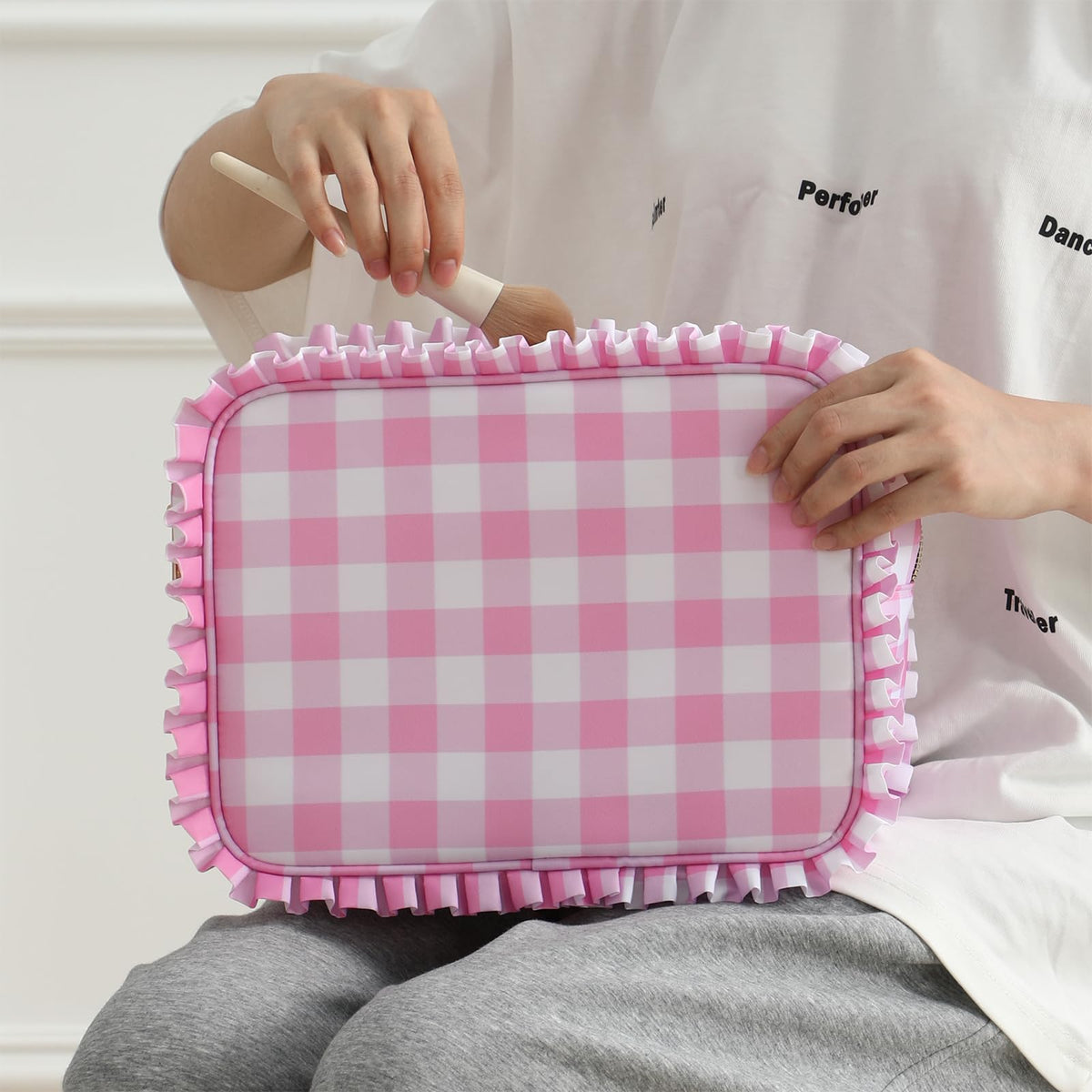 EMBRUNIOICE toiletry bag doubles as purse during trips.