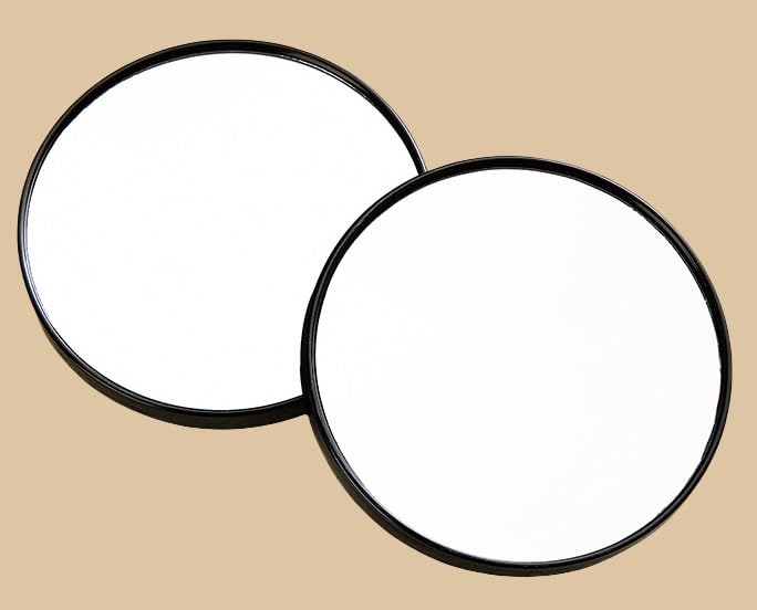 EMILYSTORES suction cup mounted mirror in a bathroom for precise grooming and makeup tasks.