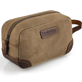 Emissary travel toiletry bag in brown, front view showing rugged canvas and leather trim for organized trips.