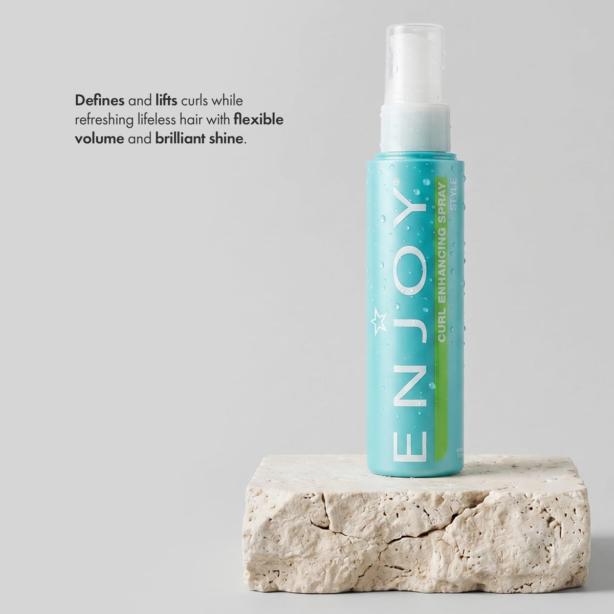 Enjoy Curl Enhancing Spray close-up shows defined curls and smooth texture.