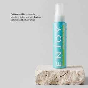Enjoy Curl Enhancing Spray close-up shows defined curls and smooth texture.
