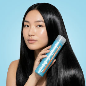 Enjoy Hydrating Shampoo flat lay packaging showcases the 33.8 oz bottle and value