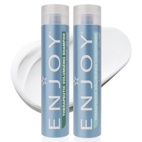 Enjoy Therapeutic Volumizing Shampoo bottle pouring, delivering lift for fine hair.