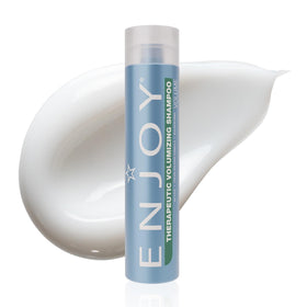 Enjoy Therapeutic Volumizing Shampoo bottle pour showing refreshing scalp-stimulating formula