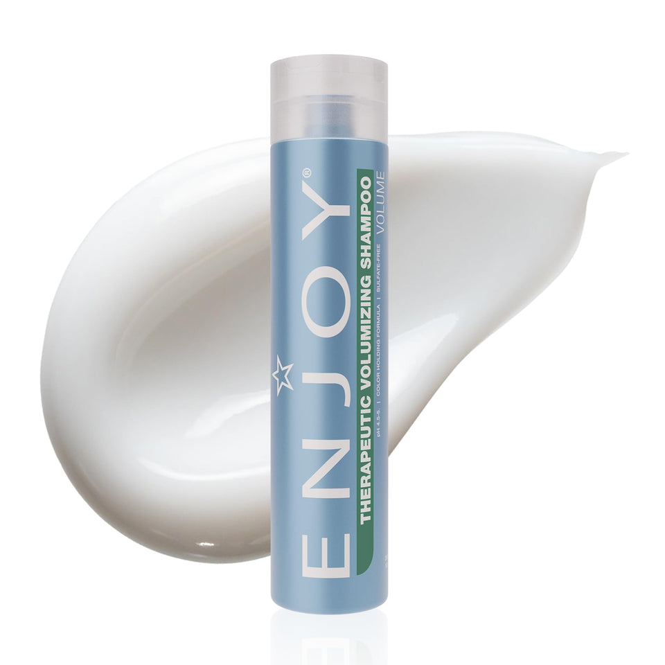 Enjoy Therapeutic Volumizing Shampoo bottle pour showing refreshing scalp-stimulating formula