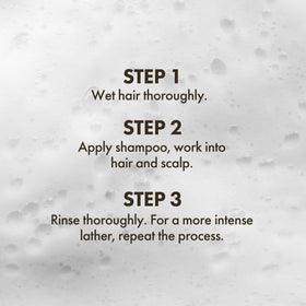 Enjoy Volumizing Shampoo on hair strands showing added volume and body
