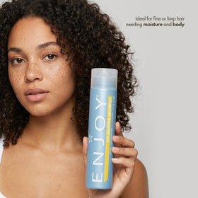 Enjoy Volumizing Shampoo label detail emphasizing pH-balanced formula for scalp comfort