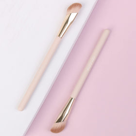ENZO KEN angled concealer brush with pink gold aesthetic on vanity