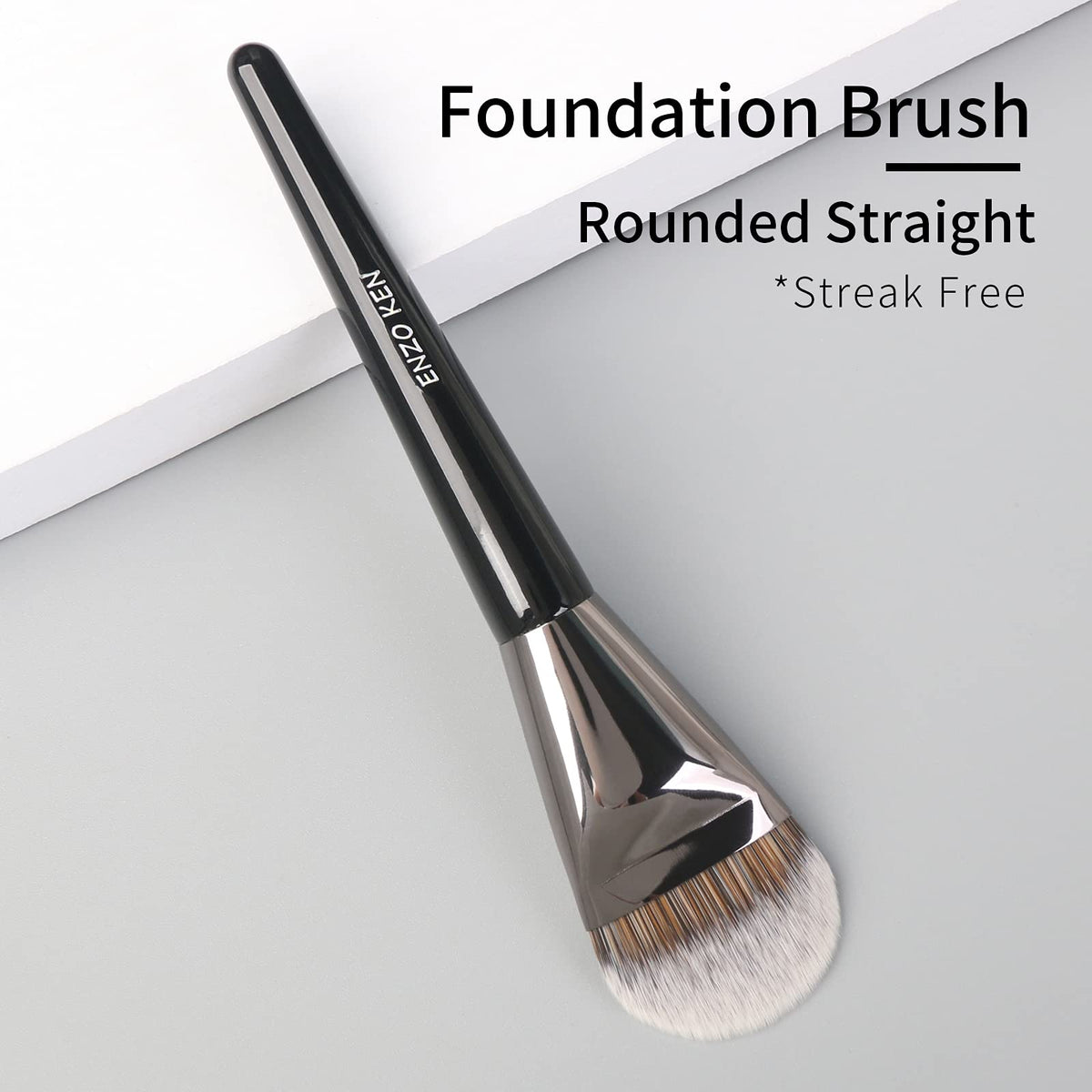 ENZO KEN soft synthetic bristles on a flat foundation brush for gentle blending