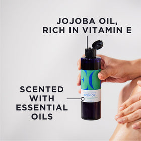 EO Grapefruit Mint Body Oil pour shot highlighting minty coolness.