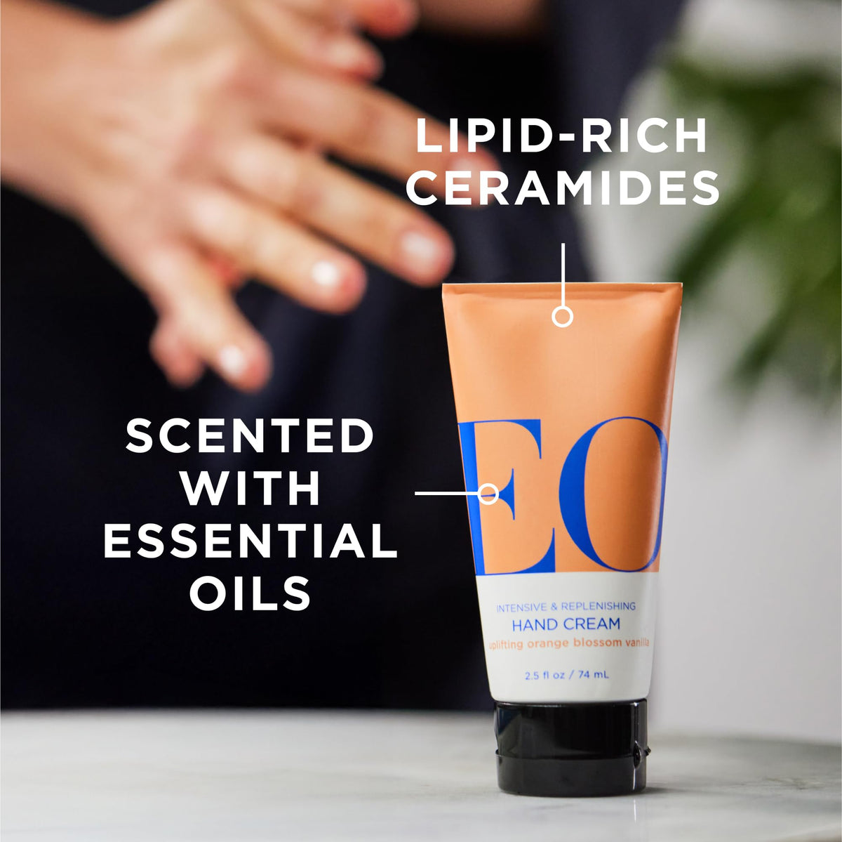 Close-up of EO hand cream bottle highlighting orange blossom vanilla scent