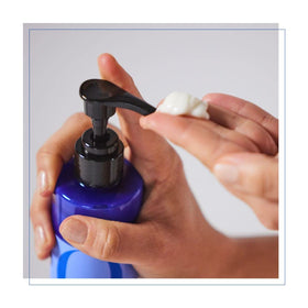 Product shot with natural ingredients backdrop suggesting organic-inspired care