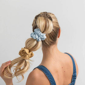 White and blue satin scrunchies simplify wedding party styling and coordination.