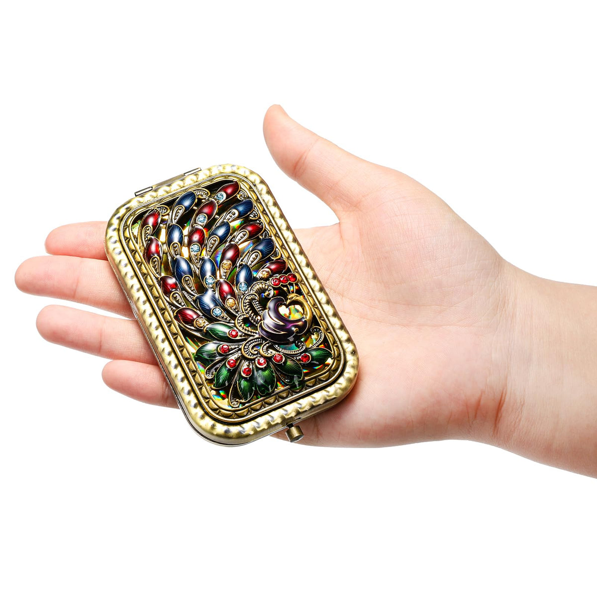 Eorbow peacock compact mirror closed, vintage elegance on the go.