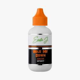 Ericka J Hold Me Down adhesive bottle with peach essence for secure wear.