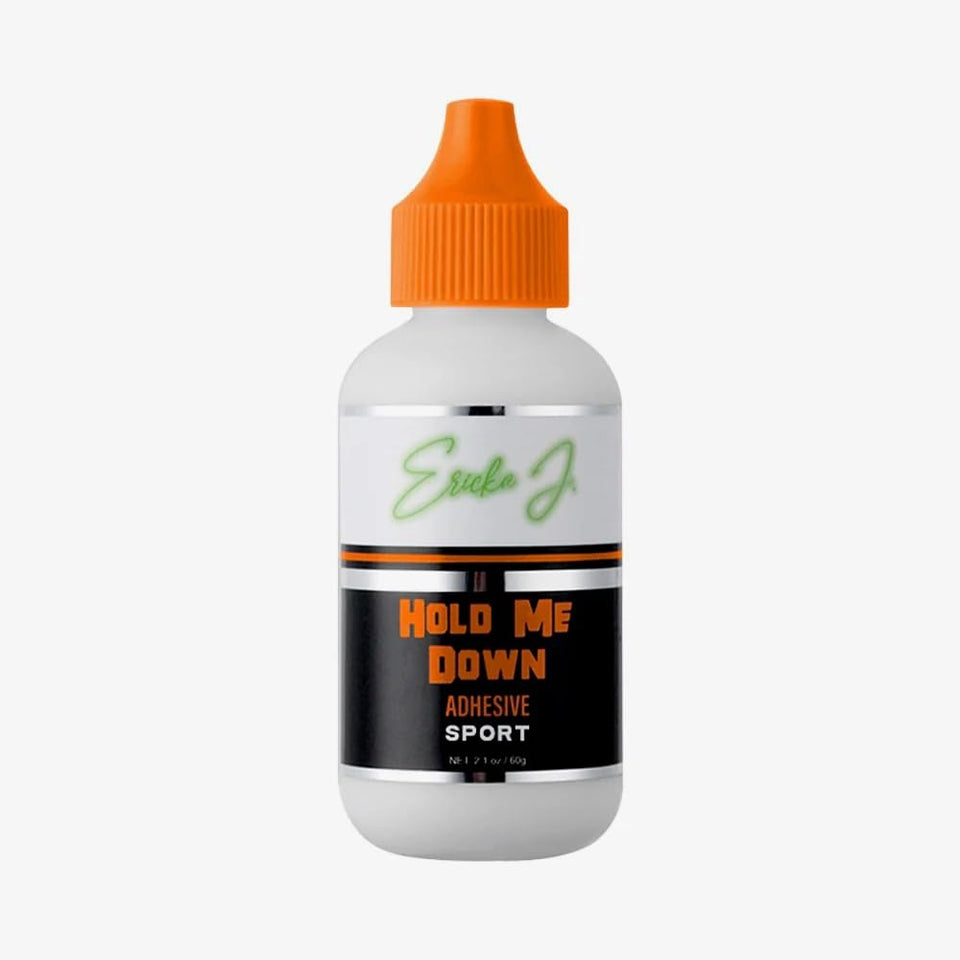 Ericka J Hold Me Down adhesive bottle with peach essence for secure wear.