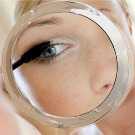 Essential Skin Solutions 6-inch round mirror with generous viewing area for detail work.