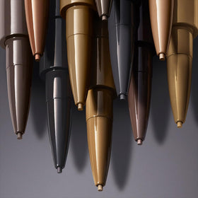 Estée Lauder BrowPerfect spool brush for precise brow grooming.