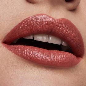 Rose Tea shade on lips under natural light with satin finish.