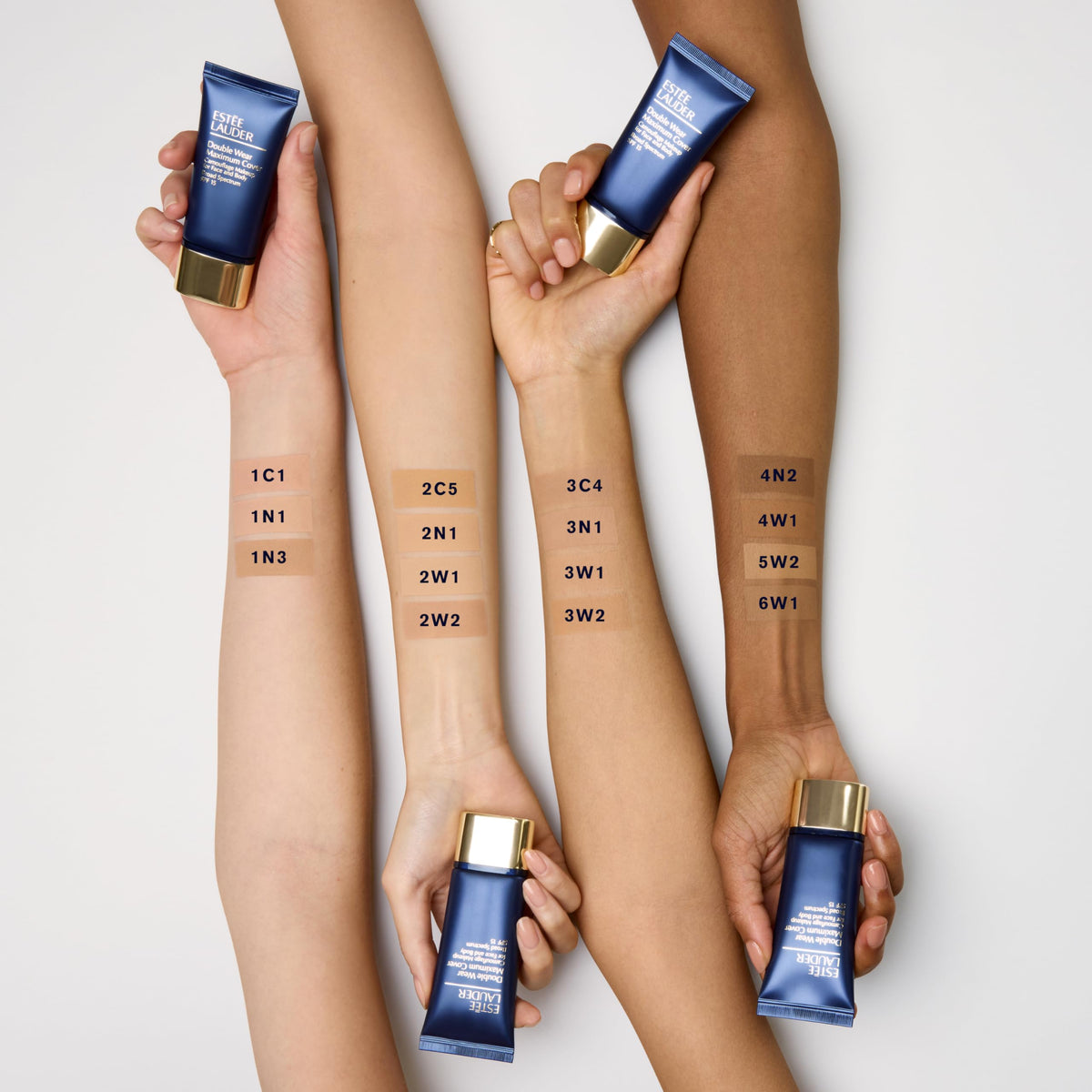 Estée Lauder Double Wear tattoo coverage on skin demonstrates waterproof concealing.
