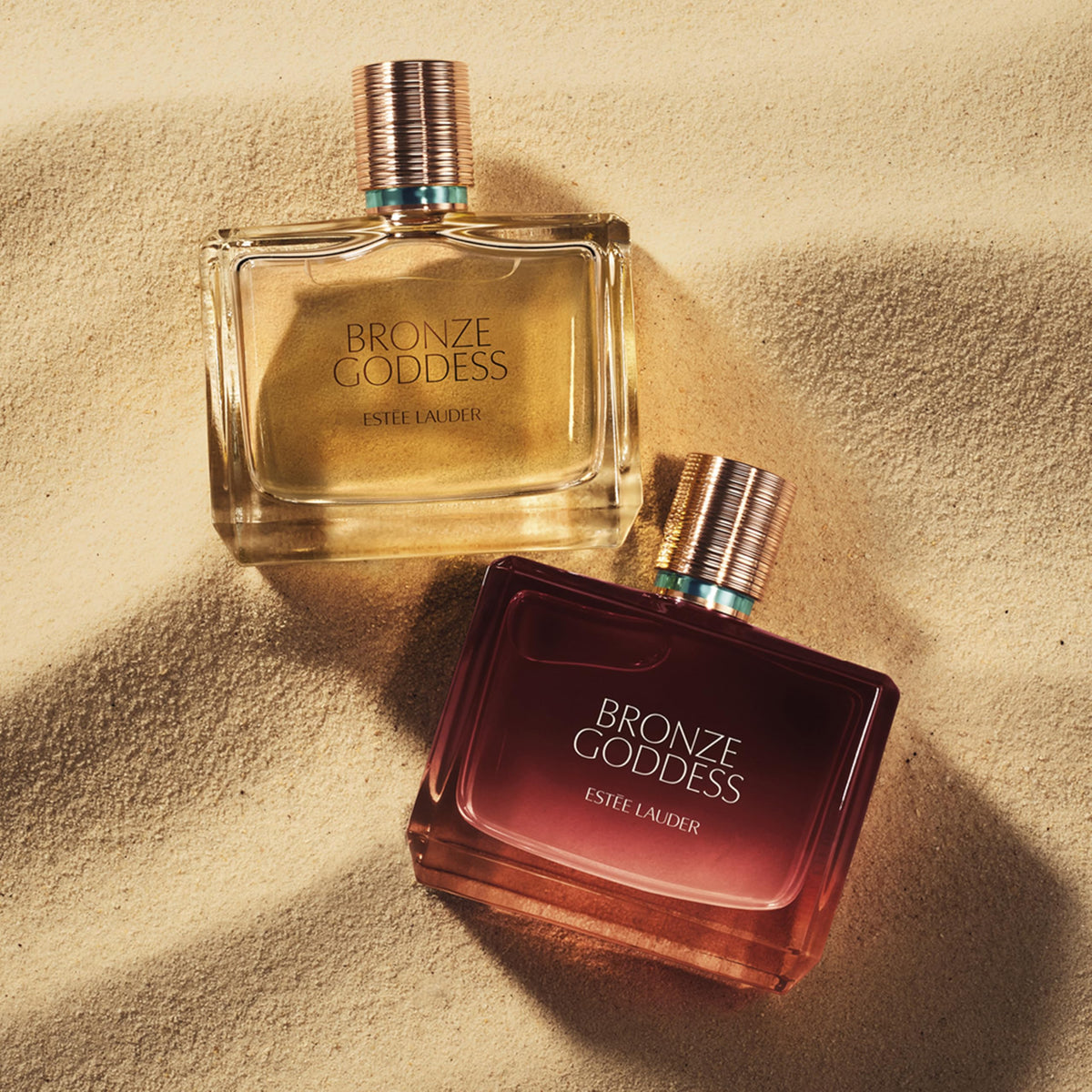 Estee Lauder Bronze Goddess amber sandalwood base for lasting warmth.