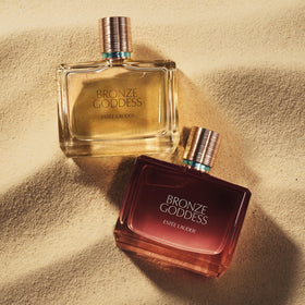 Estee Lauder Bronze Goddess amber sandalwood base for lasting warmth.