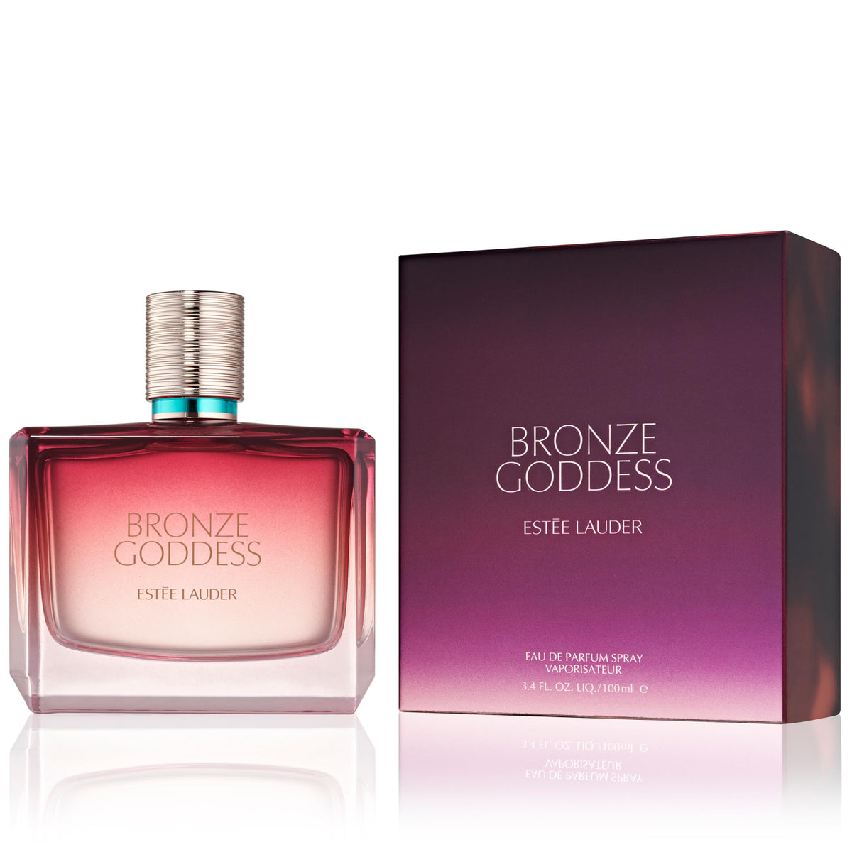 Estée Lauder Bronze Goddess bottle on sand suggests beach-ready confidence.
