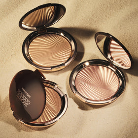 Estée Lauder Bronze Goddess Shimmering Gelee bottle highlights shoulders with radiant sheen
