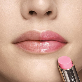 Estee Lauder Futurist HydraPlump lip balm close-up with glossy finish.