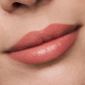 Estée Lauder lipstick case with magnetic cap and golden finish