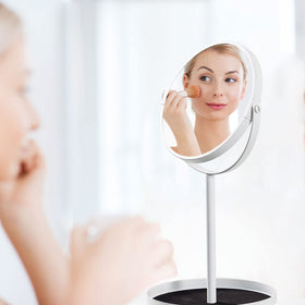Ettori mirror includes a bottom tray for small jewelry and tools.