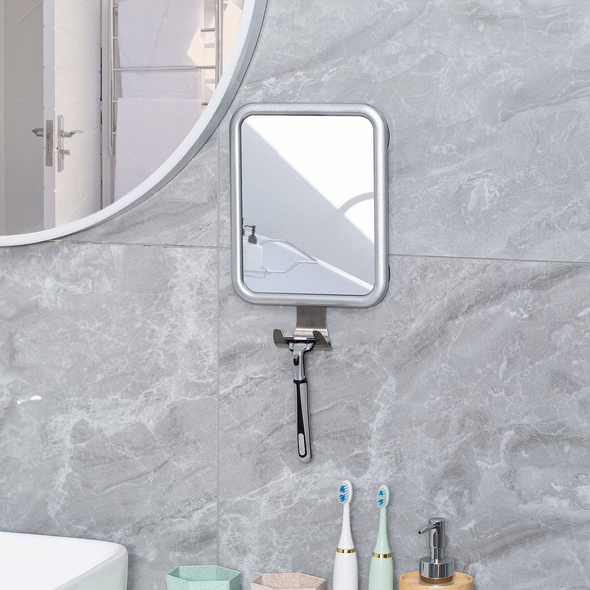 Ettori mirror mounted in a contemporary bathroom vanity area