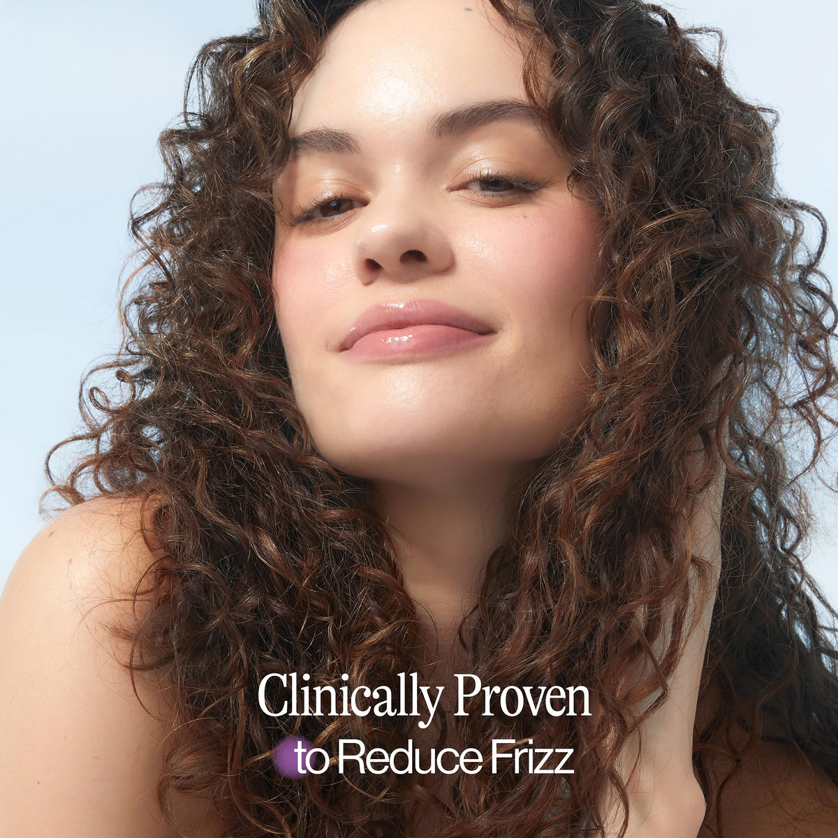 EVA NYC Mane Magic Nourishing Hair Oil on palm showing lightweight application for shine.