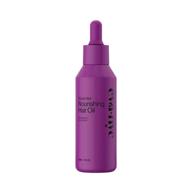 Eva NYC Quick Absorbing Oil bottle pouring for frizz control and shine.