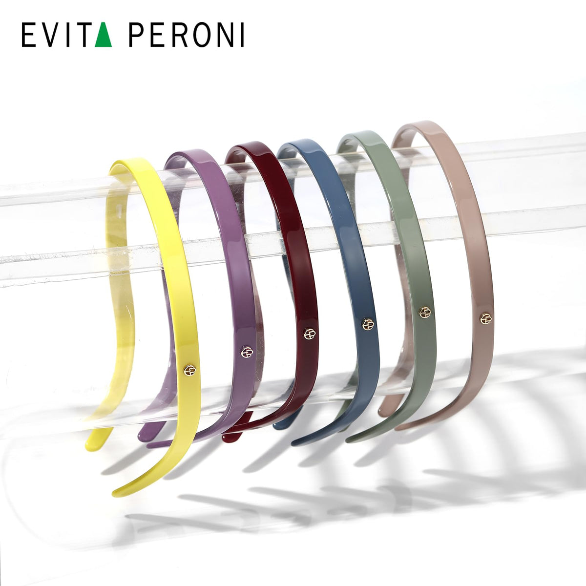 Elastic-fit EVITA PERONI headband provides secure adjustable comfort for all-day wear.