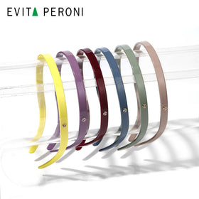 Elastic-fit EVITA PERONI headband provides secure adjustable comfort for all-day wear.