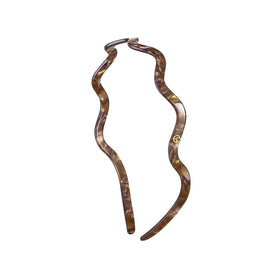 EVITA PERONI wavy glasses headband shows glass-friendly curve for comfortable all-day wear.